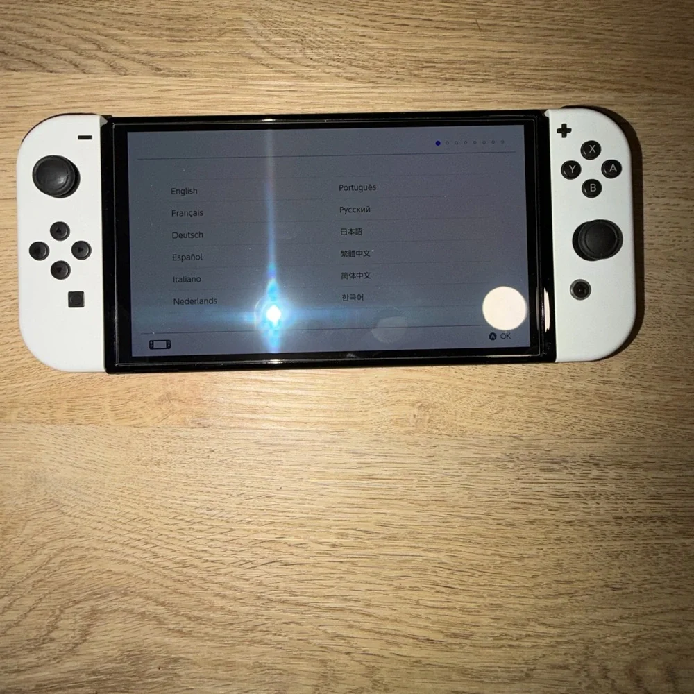 Nintendo Switch OLED (White) bundle. comes with all original parts and cords.